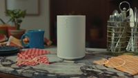 A Sonos Play speaker moves from kitchen counter to poolside table to home theater, becoming a rear surround the moment it's placed near a soundbar.
